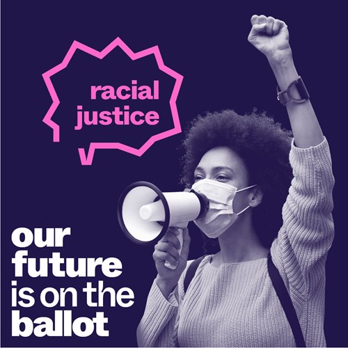 A woman wearing a mask with a megaphone at her mouth with the messages racial justice and our future is on the ballot